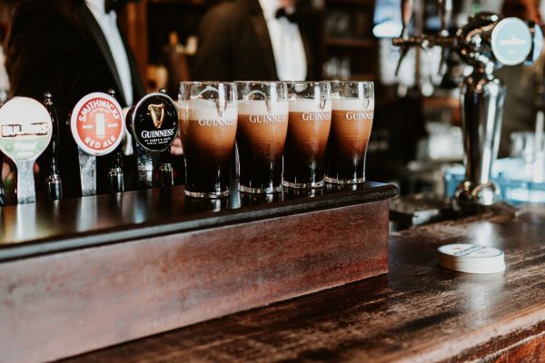 Four freshly poured pints of Guinness settling on the bar at Johnnie Fox’s