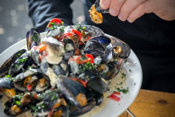 Bowl of creamy mussels with herbs and peppers served at Johnnie Fox’s