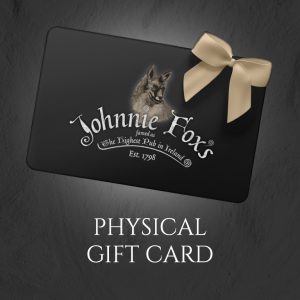 Johnnie Fox’s physical gift card with branded design and gold ribbon.