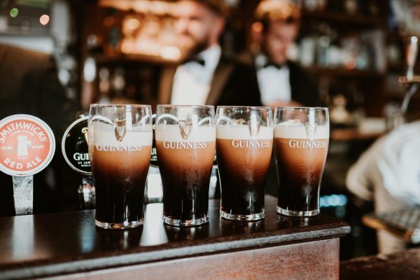 four pints of guinness on the bar